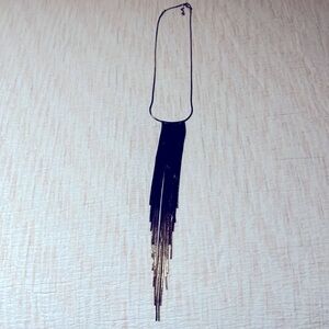 Unknown brand, in good shape. Wore this a few time. Color black & gold.